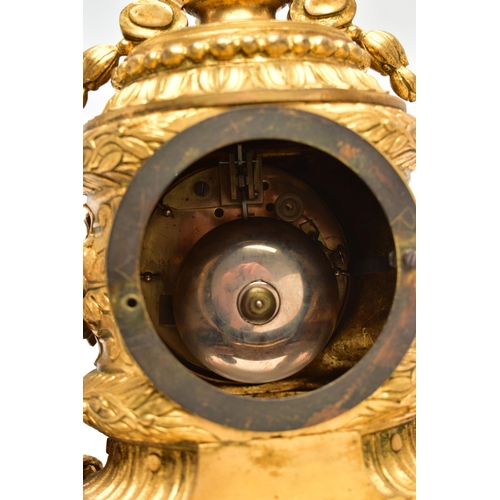 161 - A LATE 19TH CENTURY FRENCH ORMOLU MANTEL CLOCK OF SHAPED CYLINDRICAL FORM, the circular top with sea... 