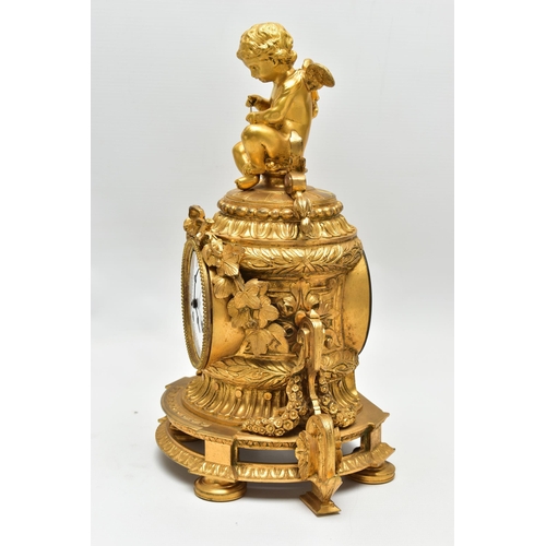 161 - A LATE 19TH CENTURY FRENCH ORMOLU MANTEL CLOCK OF SHAPED CYLINDRICAL FORM, the circular top with sea... 