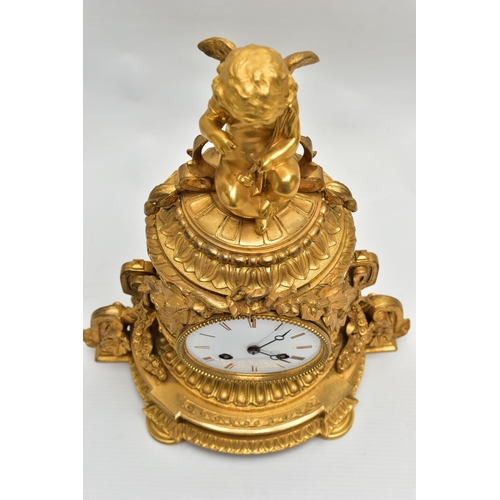 161 - A LATE 19TH CENTURY FRENCH ORMOLU MANTEL CLOCK OF SHAPED CYLINDRICAL FORM, the circular top with sea... 