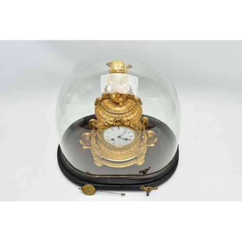 161 - A LATE 19TH CENTURY FRENCH ORMOLU MANTEL CLOCK OF SHAPED CYLINDRICAL FORM, the circular top with sea... 