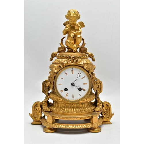 161 - A LATE 19TH CENTURY FRENCH ORMOLU MANTEL CLOCK OF SHAPED CYLINDRICAL FORM, the circular top with sea... 