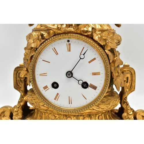 161 - A LATE 19TH CENTURY FRENCH ORMOLU MANTEL CLOCK OF SHAPED CYLINDRICAL FORM, the circular top with sea... 