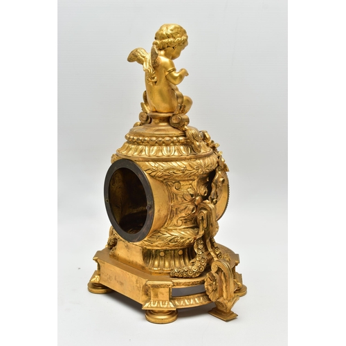 161 - A LATE 19TH CENTURY FRENCH ORMOLU MANTEL CLOCK OF SHAPED CYLINDRICAL FORM, the circular top with sea... 