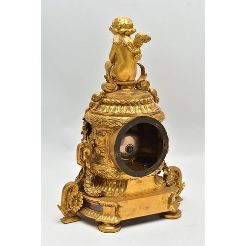 161 - A LATE 19TH CENTURY FRENCH ORMOLU MANTEL CLOCK OF SHAPED CYLINDRICAL FORM, the circular top with sea... 