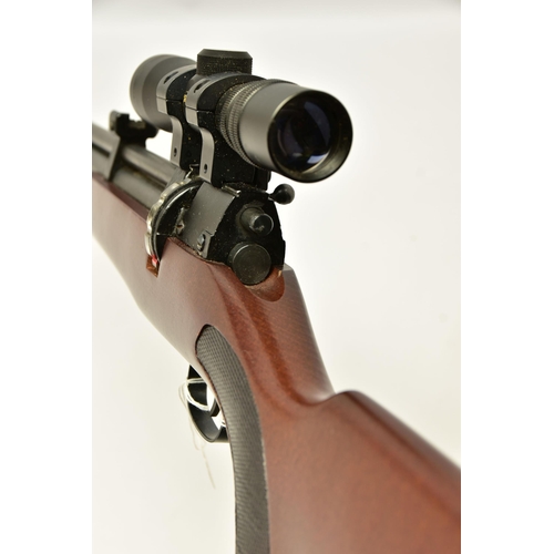 351 - A  .22 '' ROTARY MAGAZINE PUMP UP AIR RIFLE  fitted with a beech stock, in working order and excelle... 