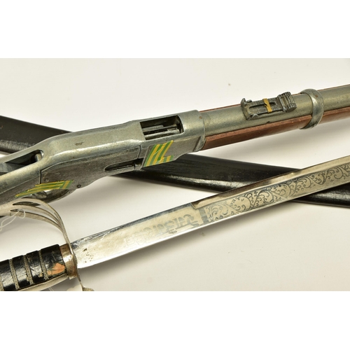 353 - AN INDIAN MADE SWORD WITH SCABBARD TOGETHER WITH A WHITE METAL COPY OF A WINCHESTER MODEL 1866 (2)