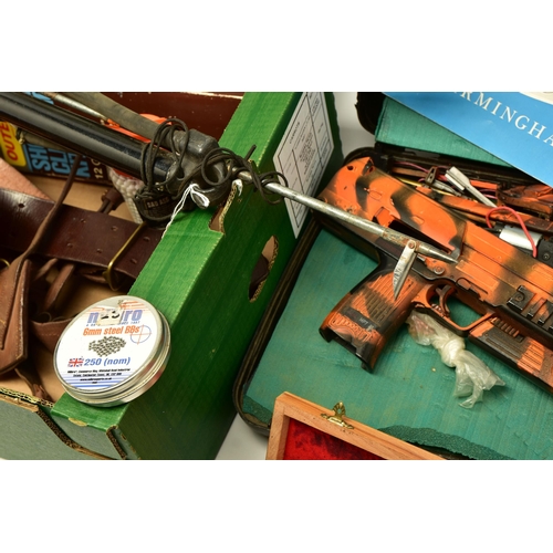 375 - AN UNDERWATER SPEAR GUN WITH SHAFT, three good quality 12 bore shotgun cleaning kits, a leather belt... 