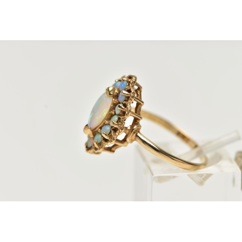 8 - A 9CT GOLD OPAL CLUSTER RING, set with a principal marquise shape opal cabochon surrounded by circul... 