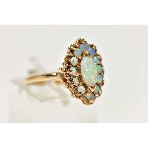 8 - A 9CT GOLD OPAL CLUSTER RING, set with a principal marquise shape opal cabochon surrounded by circul... 