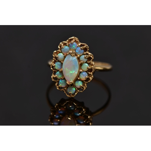 8 - A 9CT GOLD OPAL CLUSTER RING, set with a principal marquise shape opal cabochon surrounded by circul... 