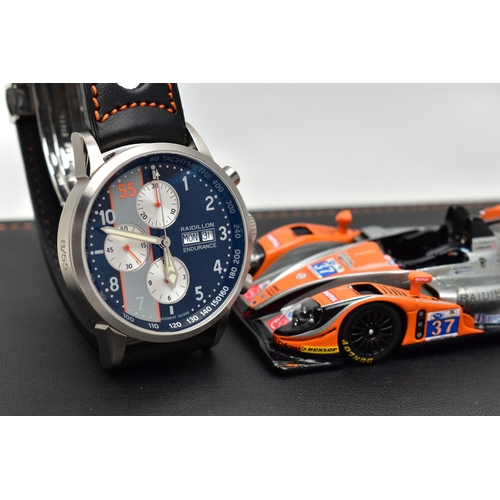 9 - A RAIDILLON 'CONQUEST ENDURANCE' DAY DATE WRISTWATCH WITH PRESENTATION BOX, the watch with black dia... 