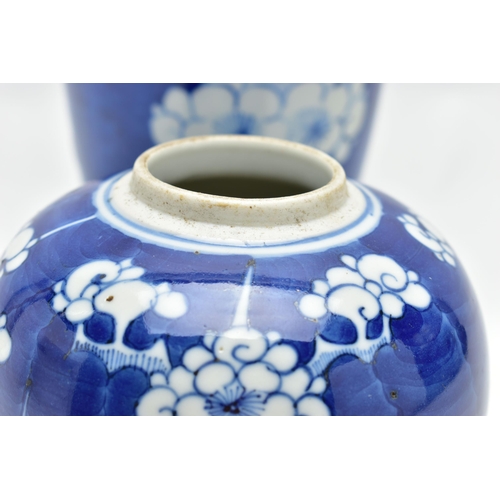 166 - AN EARLY 20TH CENTURY CHINESE BLUE AND WHITE PRUNUS BLOSSOM GINGER JAR AND COVER AND A SIMILARLY DEC... 