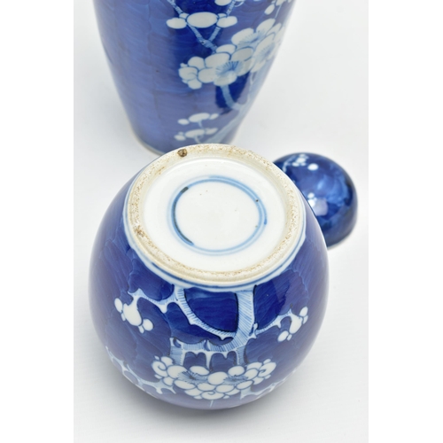 166 - AN EARLY 20TH CENTURY CHINESE BLUE AND WHITE PRUNUS BLOSSOM GINGER JAR AND COVER AND A SIMILARLY DEC... 