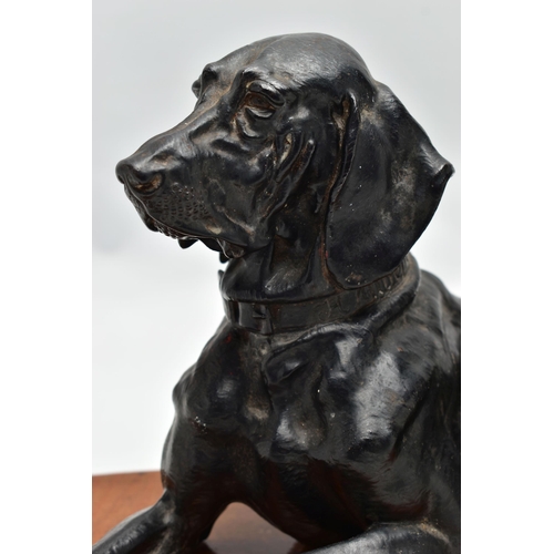 175 - AFTER NIKOLAI IVANOVICH LIBERICH (1828-1883) a cast iron figure of a recumbent bloodhound, bearing s... 