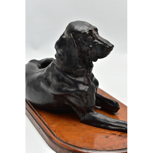 175 - AFTER NIKOLAI IVANOVICH LIBERICH (1828-1883) a cast iron figure of a recumbent bloodhound, bearing s... 