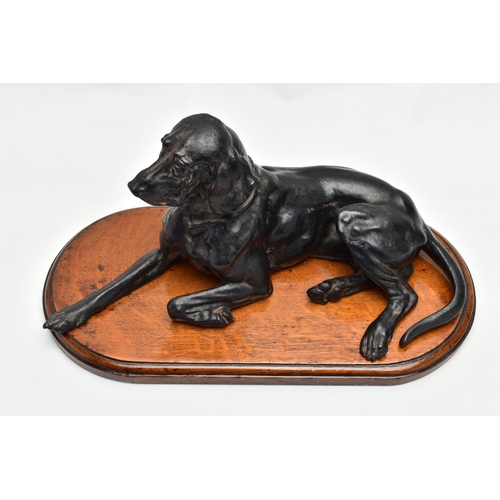 175 - AFTER NIKOLAI IVANOVICH LIBERICH (1828-1883) a cast iron figure of a recumbent bloodhound, bearing s... 