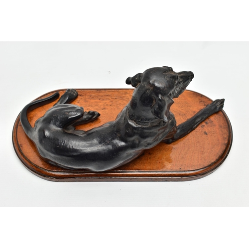 175 - AFTER NIKOLAI IVANOVICH LIBERICH (1828-1883) a cast iron figure of a recumbent bloodhound, bearing s... 