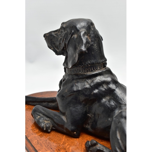 175 - AFTER NIKOLAI IVANOVICH LIBERICH (1828-1883) a cast iron figure of a recumbent bloodhound, bearing s... 