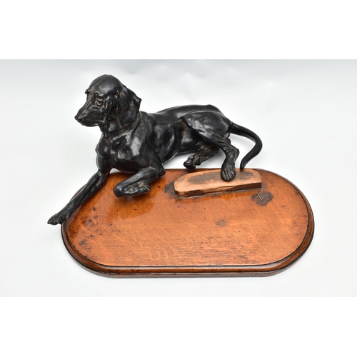 175 - AFTER NIKOLAI IVANOVICH LIBERICH (1828-1883) a cast iron figure of a recumbent bloodhound, bearing s... 