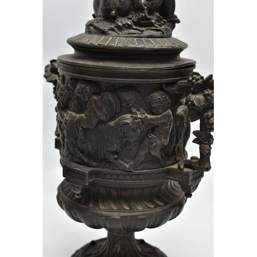 181 - A PAIR OF 19TH CENTURY BLACK PAINTED SPELTER TWIN HANDLED URNS AND COVERS, the covers cast with a pu... 