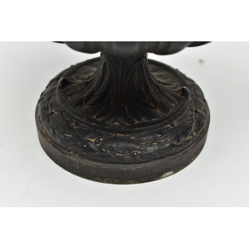 181 - A PAIR OF 19TH CENTURY BLACK PAINTED SPELTER TWIN HANDLED URNS AND COVERS, the covers cast with a pu... 