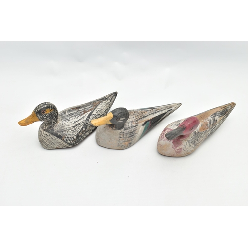 182 - THREE CARVED WOODEN DECOY DUCKS WITH POLYCHROME PAINTED DECORATION, impressed circle eyes, slightly ... 