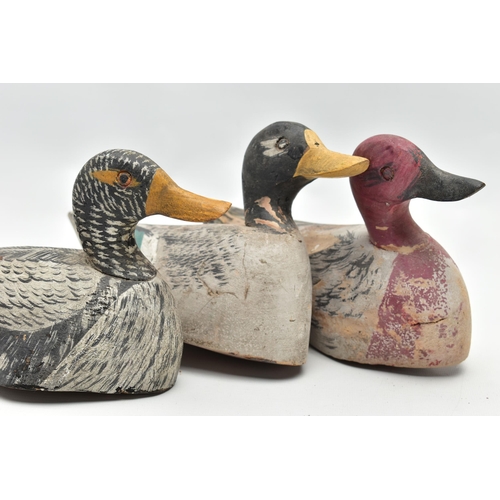 182 - THREE CARVED WOODEN DECOY DUCKS WITH POLYCHROME PAINTED DECORATION, impressed circle eyes, slightly ... 