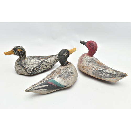 182 - THREE CARVED WOODEN DECOY DUCKS WITH POLYCHROME PAINTED DECORATION, impressed circle eyes, slightly ... 