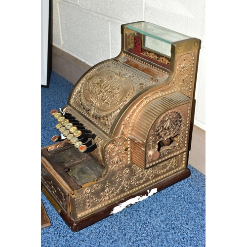 187 - A 20TH CENTURY AMERICAN BRASS CASH REGISTER BY NATIONAL DAYTON OF OHIO, mounted on a wooden plinth, ... 