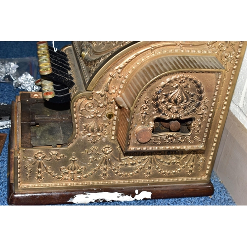 187 - A 20TH CENTURY AMERICAN BRASS CASH REGISTER BY NATIONAL DAYTON OF OHIO, mounted on a wooden plinth, ... 