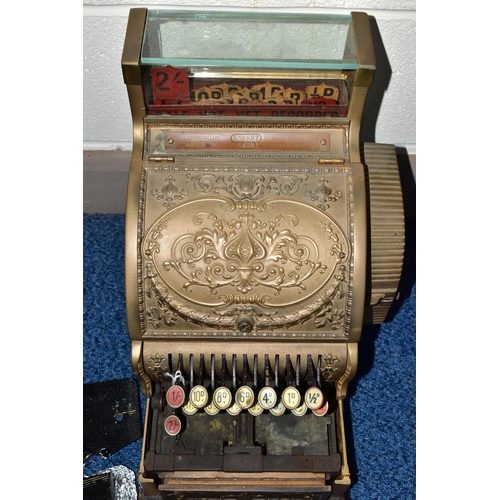 187 - A 20TH CENTURY AMERICAN BRASS CASH REGISTER BY NATIONAL DAYTON OF OHIO, mounted on a wooden plinth, ... 