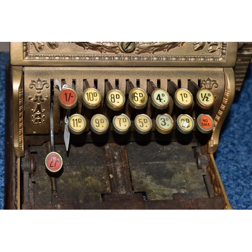 187 - A 20TH CENTURY AMERICAN BRASS CASH REGISTER BY NATIONAL DAYTON OF OHIO, mounted on a wooden plinth, ... 