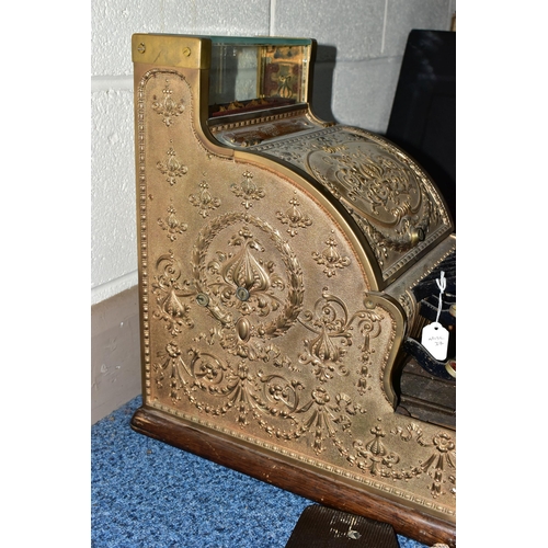 187 - A 20TH CENTURY AMERICAN BRASS CASH REGISTER BY NATIONAL DAYTON OF OHIO, mounted on a wooden plinth, ... 