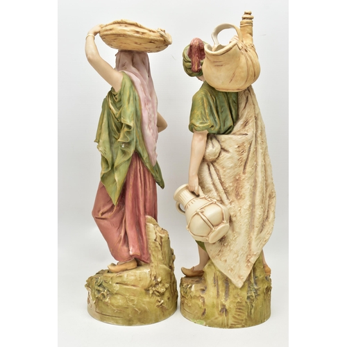 195 - A PAIR OF ROYAL DUX FIGURES OF MALE AND FEMALE WATER CARRIERS, modelled as standing on circular base... 