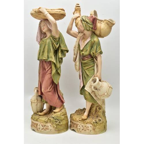 195 - A PAIR OF ROYAL DUX FIGURES OF MALE AND FEMALE WATER CARRIERS, modelled as standing on circular base... 