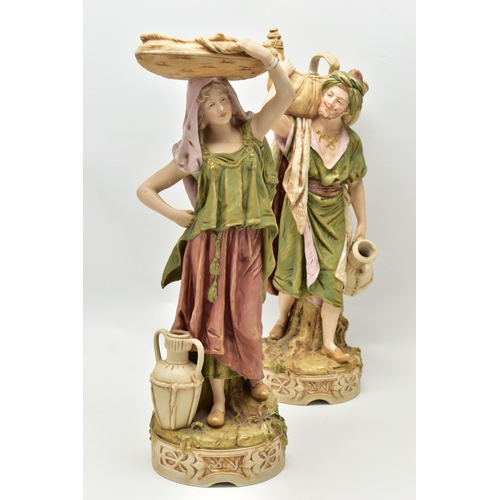 195 - A PAIR OF ROYAL DUX FIGURES OF MALE AND FEMALE WATER CARRIERS, modelled as standing on circular base... 