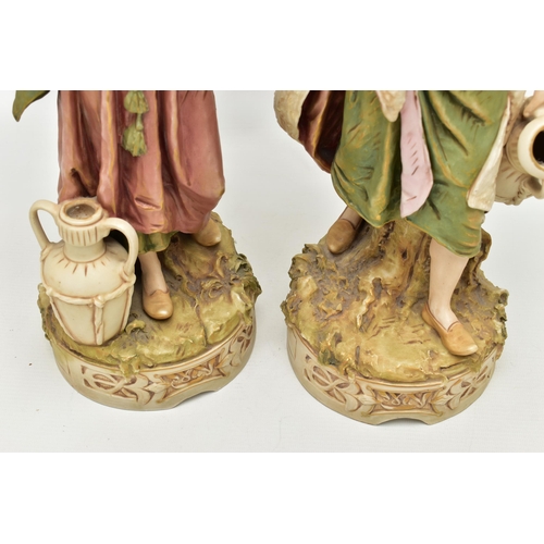 195 - A PAIR OF ROYAL DUX FIGURES OF MALE AND FEMALE WATER CARRIERS, modelled as standing on circular base... 