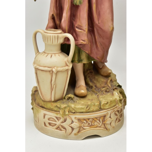 195 - A PAIR OF ROYAL DUX FIGURES OF MALE AND FEMALE WATER CARRIERS, modelled as standing on circular base... 