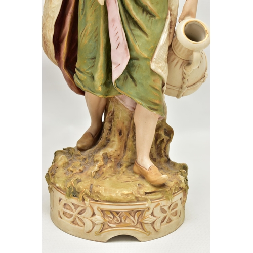 195 - A PAIR OF ROYAL DUX FIGURES OF MALE AND FEMALE WATER CARRIERS, modelled as standing on circular base... 