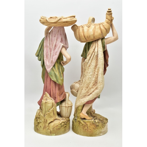 195 - A PAIR OF ROYAL DUX FIGURES OF MALE AND FEMALE WATER CARRIERS, modelled as standing on circular base... 