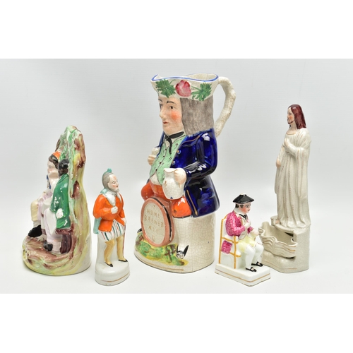 215 - A VICTORIAN STAFFORDSHIRE POTTERY TOBY JUG AND FOUR VICTORIAN STAFFORDSHIRE FIGURES, comprising a ju... 