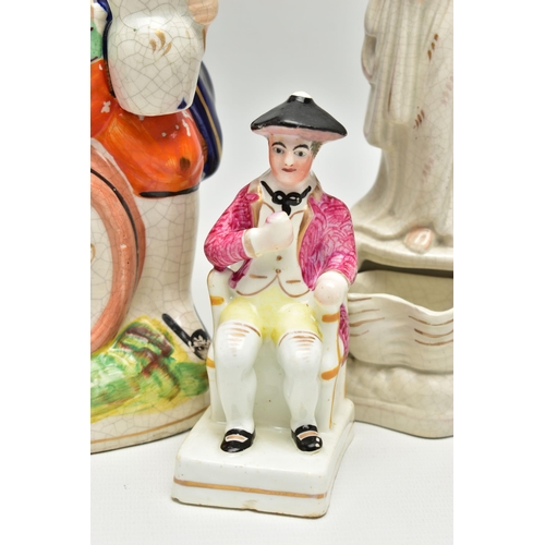 215 - A VICTORIAN STAFFORDSHIRE POTTERY TOBY JUG AND FOUR VICTORIAN STAFFORDSHIRE FIGURES, comprising a ju... 