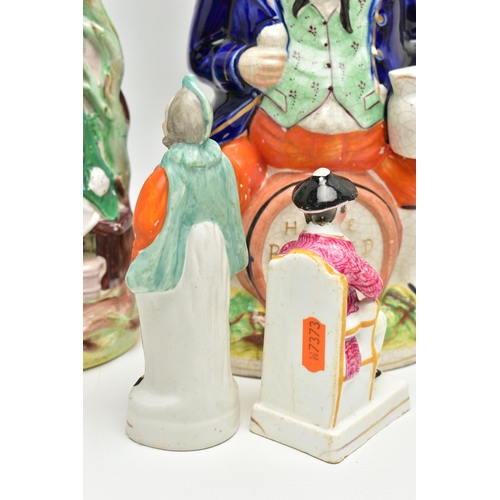 215 - A VICTORIAN STAFFORDSHIRE POTTERY TOBY JUG AND FOUR VICTORIAN STAFFORDSHIRE FIGURES, comprising a ju... 