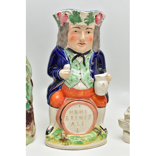 215 - A VICTORIAN STAFFORDSHIRE POTTERY TOBY JUG AND FOUR VICTORIAN STAFFORDSHIRE FIGURES, comprising a ju... 