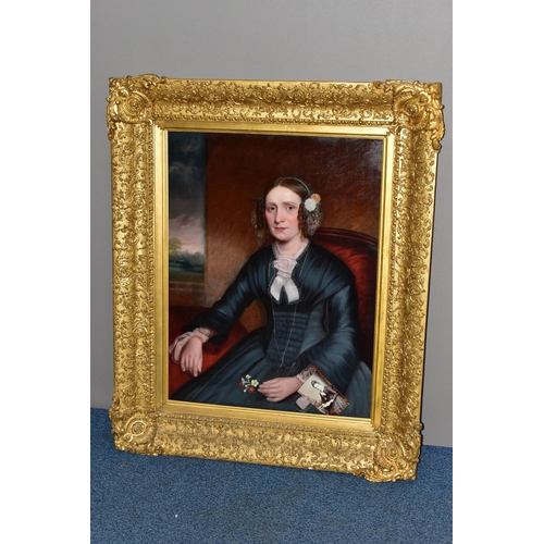 303 - MID 19TH CENTURY ENGLISH SCHOOL, Half-length portrait of a seated lady in an interior, oil on reline... 