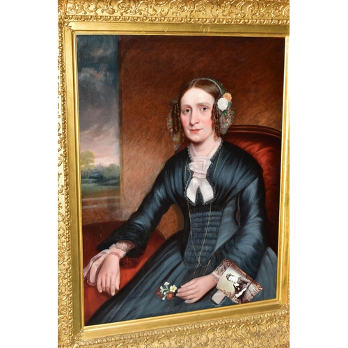 303 - MID 19TH CENTURY ENGLISH SCHOOL, Half-length portrait of a seated lady in an interior, oil on reline... 