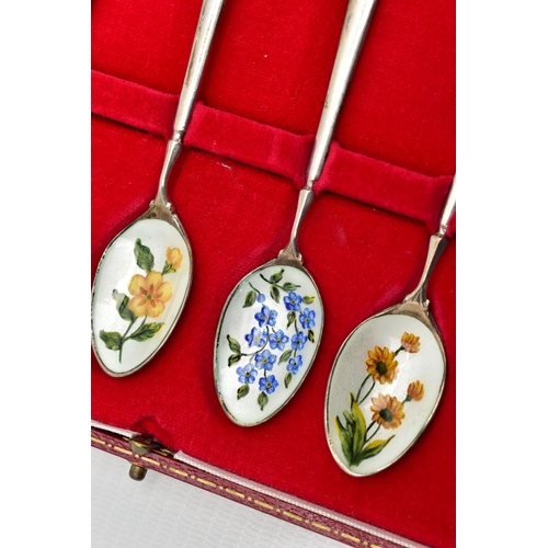 45 - A CASED SET OF SIX ELIZABETH II SILVER AND ENAMEL COFFEE SPOONS, the bowl of each spoon painted with... 