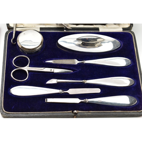 57 - A PARCEL OF CASED AND LOOSE SILVER, including a pair of Edwardian steel boot pulls with silver handl... 