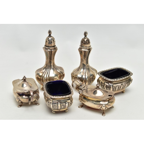 101 - AN ASSORTMENT OF CONDIMENT SETS, to include a pair of Edwardian silver pepperettes, hallmark rubbed ... 