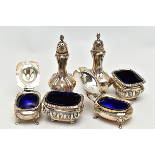 101 - AN ASSORTMENT OF CONDIMENT SETS, to include a pair of Edwardian silver pepperettes, hallmark rubbed ... 